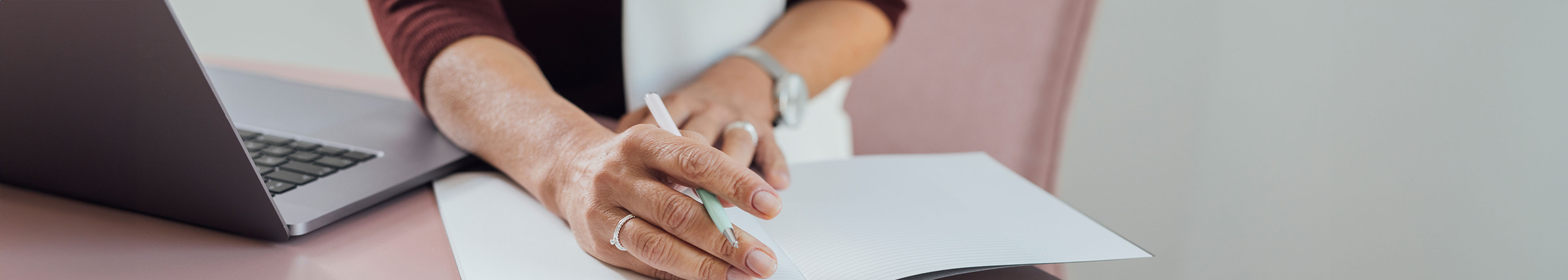 Woman writing on a notebook